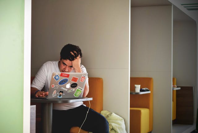 sad man victim of ghosting waiting for his girl to talk to him online